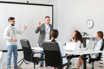 Team of doctors during meeting in modern clinic