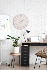 Stylish workplace with modern gadgets in office