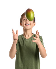 Cute little boy with fresh tasty mango on white background