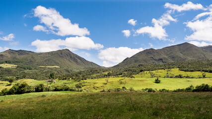 landscape with mountains and sky view of the valley of the mountains hills road to the mountains exotic landscape adventure mountains  blue sky escape wild  rural landscape freedom heaven