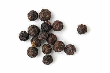 Black peppercorns isolated on white background.
