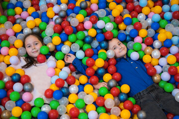 Fototapeta na wymiar children in colored balls