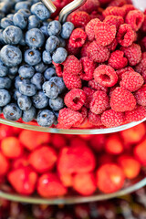 plate with summer berries-raspberries, strawberries, blueberries. dessert