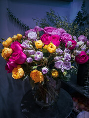 A large bouquet of delicate roses of different colors
