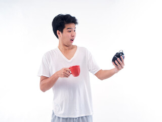 Man with alarm clock and cup coffee