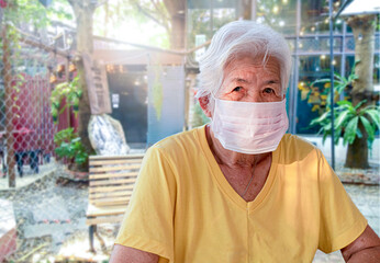 Senior Asian Women Wear a mask to prevent COVID-19.