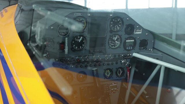 dashboard of a light aircraft parked in the hangar
