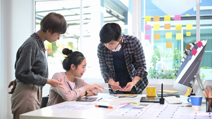 Group of creative designer people brainstorming and discussing new project plan in modern office.