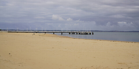 sand beach in low tide in arcachon bay pontoon Pier of Andernos les Bains France