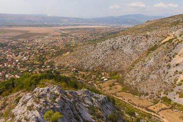 Fototapeta na wymiar View from the top of the mountain on the town of Blagaj on a sunny day. Bosnia and Herzegovina