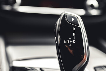Luxury modern car interior. Automatic gearbox lever; Automatic transmission gearshift stick....