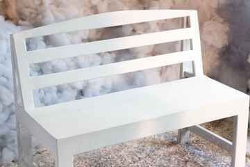 wood white chair with half shadow half light