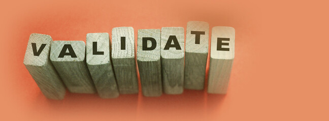 Validate word on Wooden Blocks. Business evaluation concept