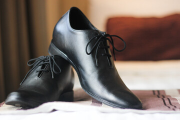 a pair of black leather shoes