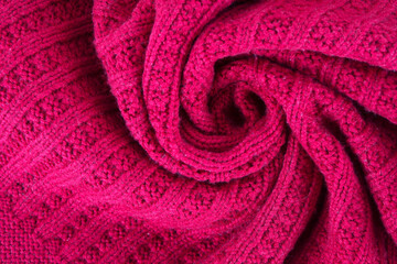 Fototapeta na wymiar Red knitted scarf texture background