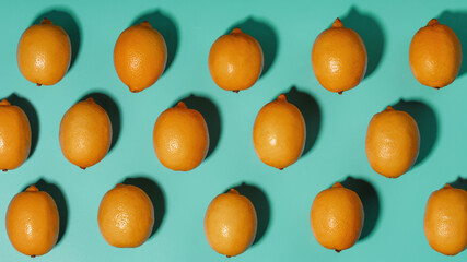 Lemons on a blue background with a pattern in the form of a pattern.