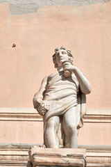 statue on buildings facade in Cagliari center (Bastion of Saint Remy).