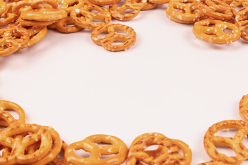 yellow pretzels folded in a frame in a circle