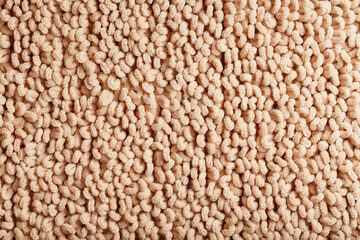 The structure of beige wool fibers in full screen as a background.
