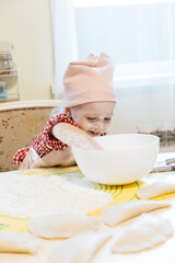 Little girl baking in the kitchen at home