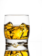 Whisky on the rocks on white background