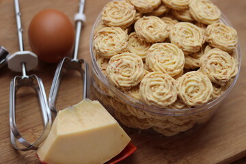 dry cookies on a plastic jar with cheese and egg