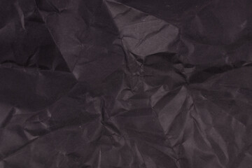 black paper is unevenly wrinkled