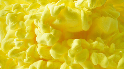 Abstract yellow ink in water