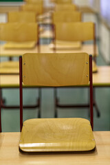 School chairs on desks as students remain absent during the Corona virus.	