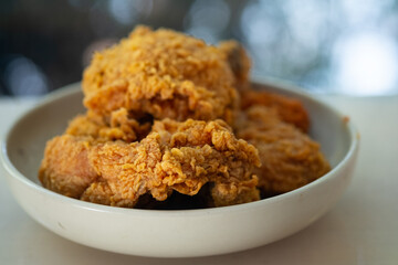 Crispy fresh fried chicken on a white plate