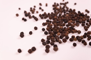 brown and black balls are scattered on a white surface