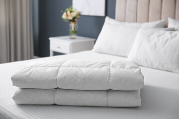 Soft folded blanket on bed at home - obrazy, fototapety, plakaty