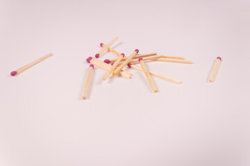 a pile of matches and two matches on opposite sides