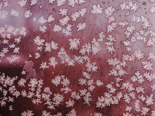 Winter frosty patterns on window glass. Close-up.