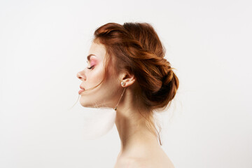emotional woman bare shoulders fluffy earrings luxury clear skin light background