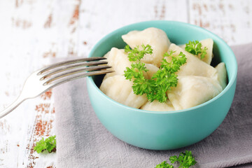 Russian national dish pelmeni served in a plate