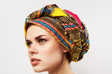 beautiful woman multicolored turban on her head decoration traditional clothing close-up