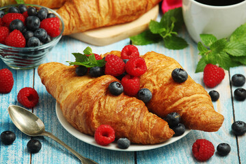 Croissants with fresh berries for breakfast