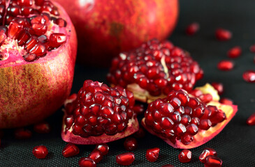 Cut pomegranate close-up on the table.