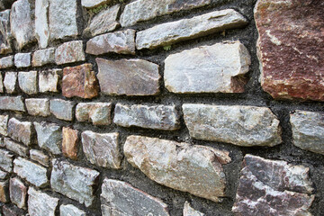 Stone wall textured background at an angle