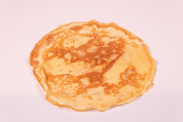 yellow pancake with spots diagonal view
