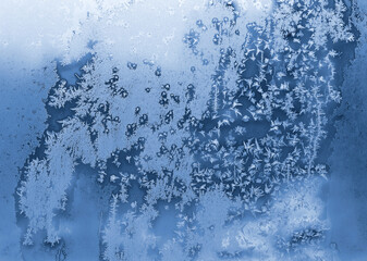 Texture of winter window glass with beautiful ice pattern