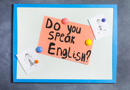 Board with question Do You Speak English on grey background, top view
