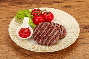 Grilled burger cutlet with sauce