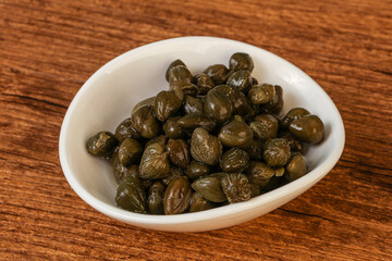 Tasty capers in the bowl