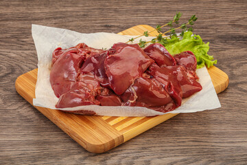 Raw chicken liver over board