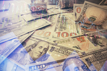 Fototapeta premium Multi exposure of forex chart drawing over us dollars bill background. Concept of financial success markets.