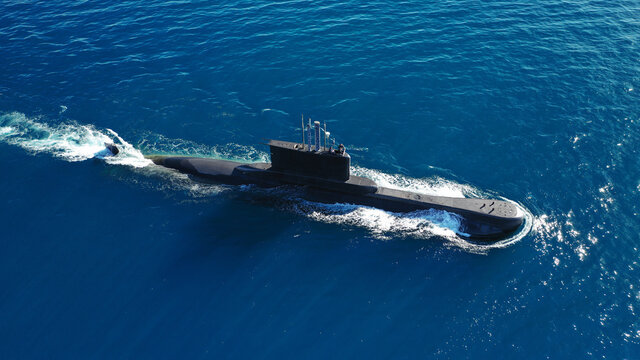 Aerial drone photo of latest technology navy armed diesel powered submarine cruising half submerged