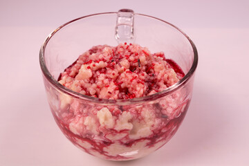 Transparent mug with ice cream decorated with red