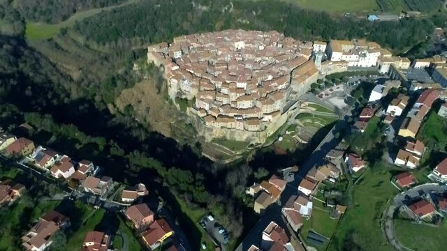Aerial view of Farnese, A village in Viterbo, houses, roads and a landscape
